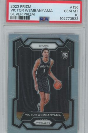 A graded 2023 Prizm basketball trading card features Victor Wembanyama of the Spurs, holding a basketball. The card is labeled GEM MT 10 by PSA and has a Silver Prizm designation.